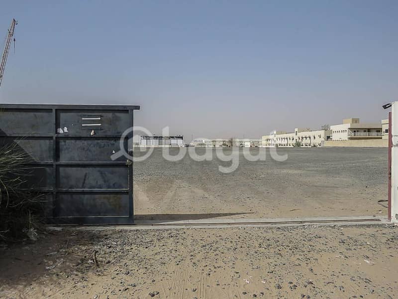 BIG OPEN LAND FOR RENT  215000/SQFT WITH ELECTRICITY AND WATER AND CIVIL DEFENSE APPROVED IN AL SAJAA