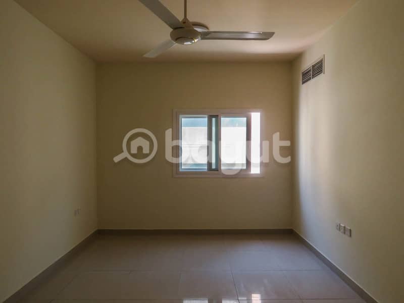 For rent in Ajman, a two-room apartment and a hall with 3 bathrooms, with wall cabinets and a separate hall, very large areas, the location in Al Jurf