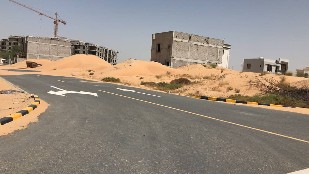 For sale in Ajman, Al Zahia area, land at a snapshot price, an area of ​​17