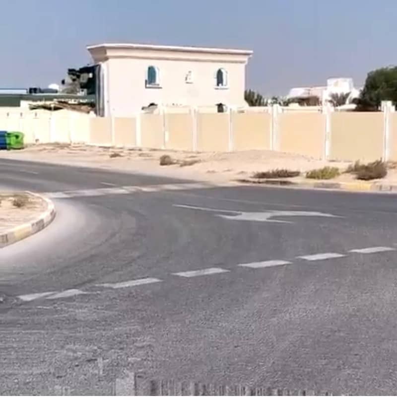 Land for sale in the Emirate of Sharjah, Al Muwafjah area, corner   directly opposite the garden
