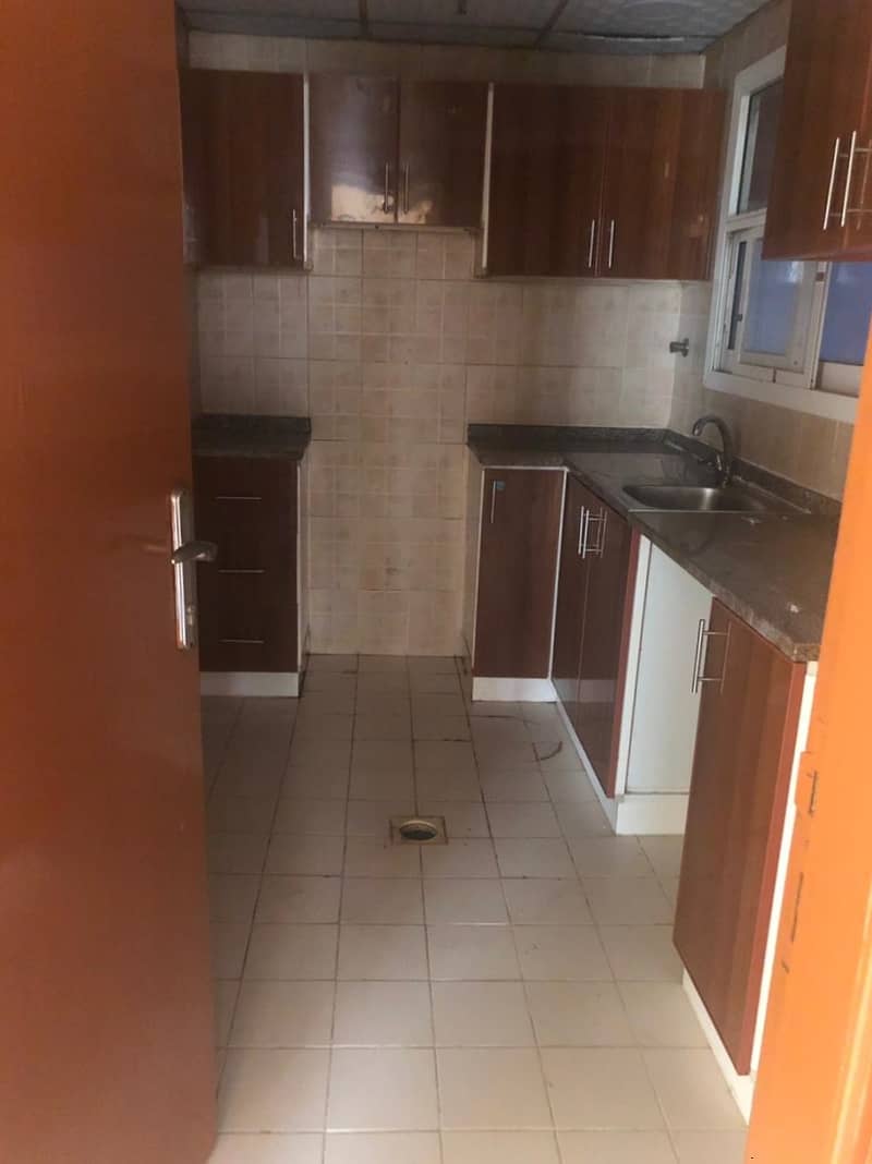 An exclusive and special offer in Al-Rumaila 1, Ajman, for annual rent, a two-room apartment and a hall, area 1300, at a fantastic price for a limited