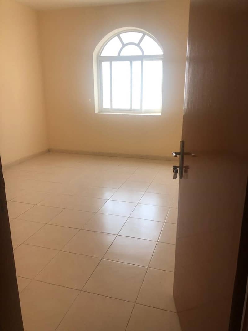 An exclusive and special offer in Al-Rumaila 1, Ajman, for annual rent, a two-room apartment and a hall, area 1300, at a fantastic price for a limited