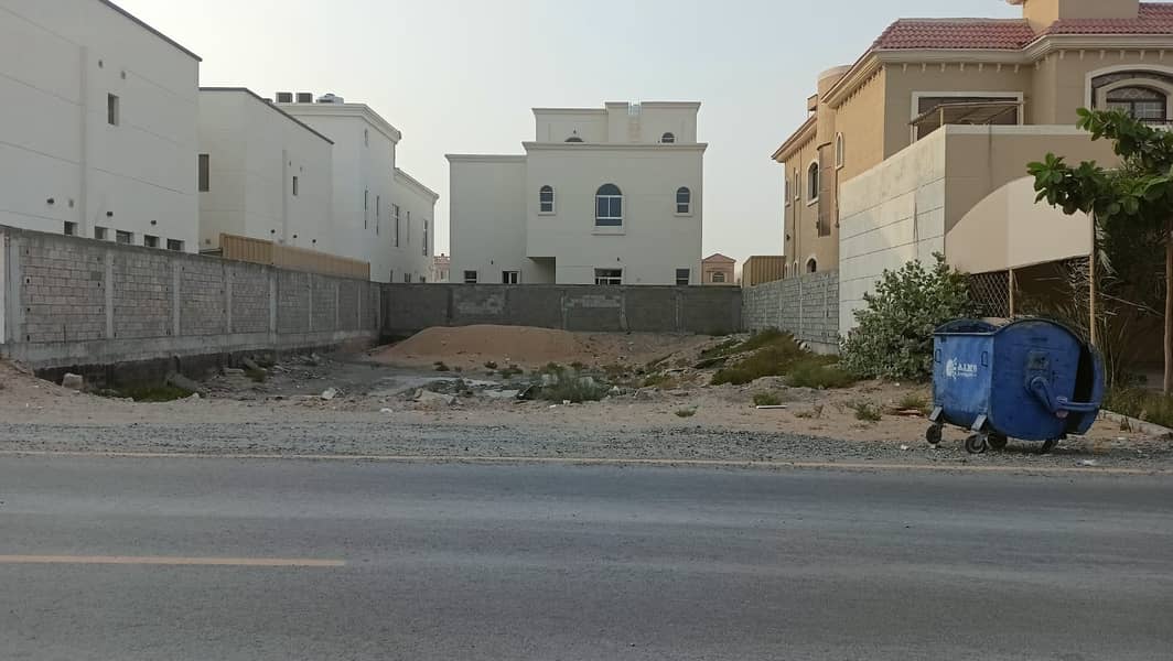 Commercial residential land for sale in Al Mowaihat 1 on Al Tallah Street on a main street, freehold for all nationalities