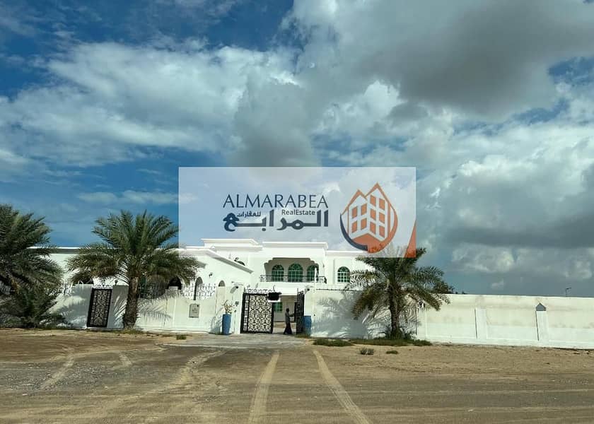 For sale a large villa on the main street, corner  in Ramaqiya area in Sharjah, main Villa + Annex