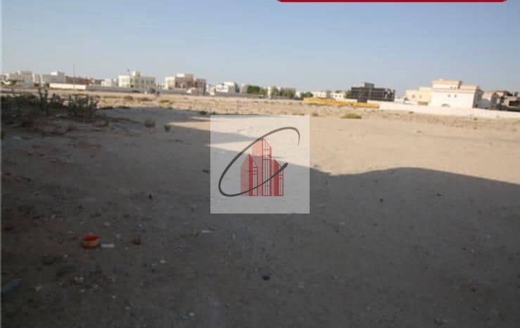 For sale residential land in Al Shamkha, a corner, two streets, and a main street.