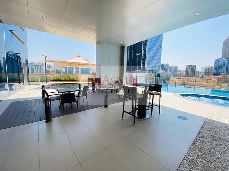 LUXURIOUS. : One Bedroom Apartment with Balcony & all Facilities Available in Corniche Area  for AED 70,000 Only. !
