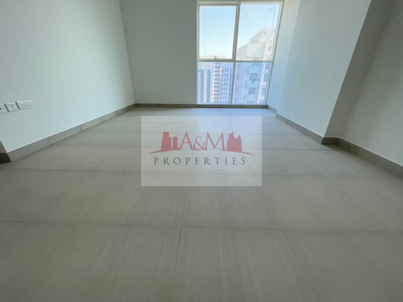BRAND NEW. : Two Bedroom Apartment with Basement parking in Tourist Club Area for AED 60,000 Only. !!