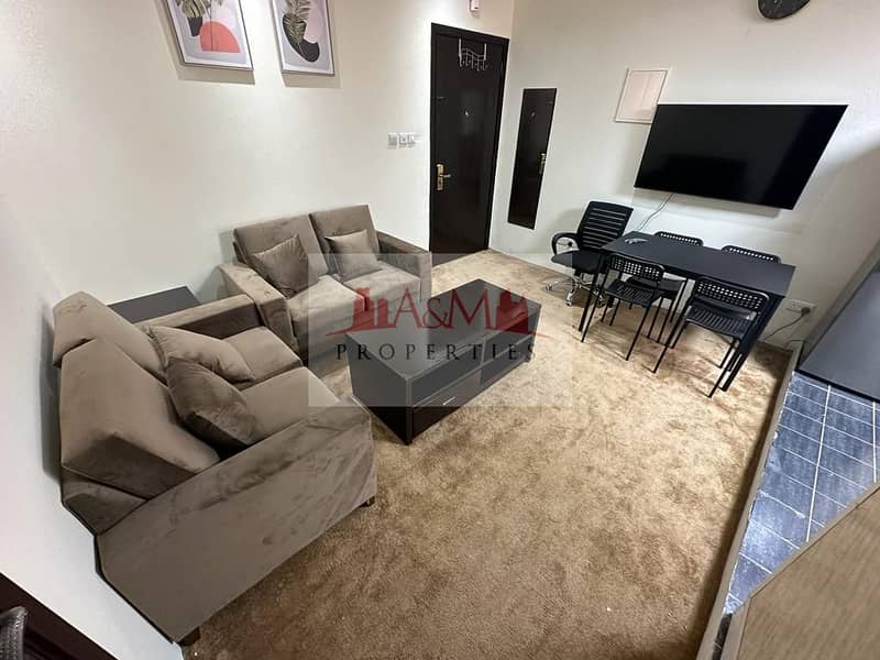 FULLY FURNISHED | One Bedroom Apartment with Balcony in Hamdan Street for AED 5,500 Monthly. . !