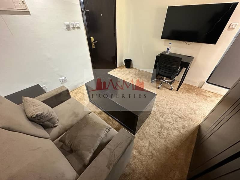 Fully Furnished | Studio Apartment with Balcony in Hamdan Street for AED 4,500 Monthly. . !!