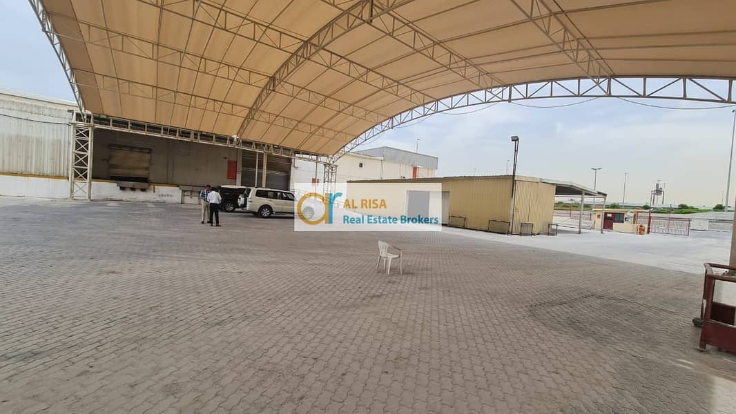 Spacious Warehouse with Offices, Storage, and Parking at Nadd Al Hamar Road - Total Area: 70,000 sq. ft.