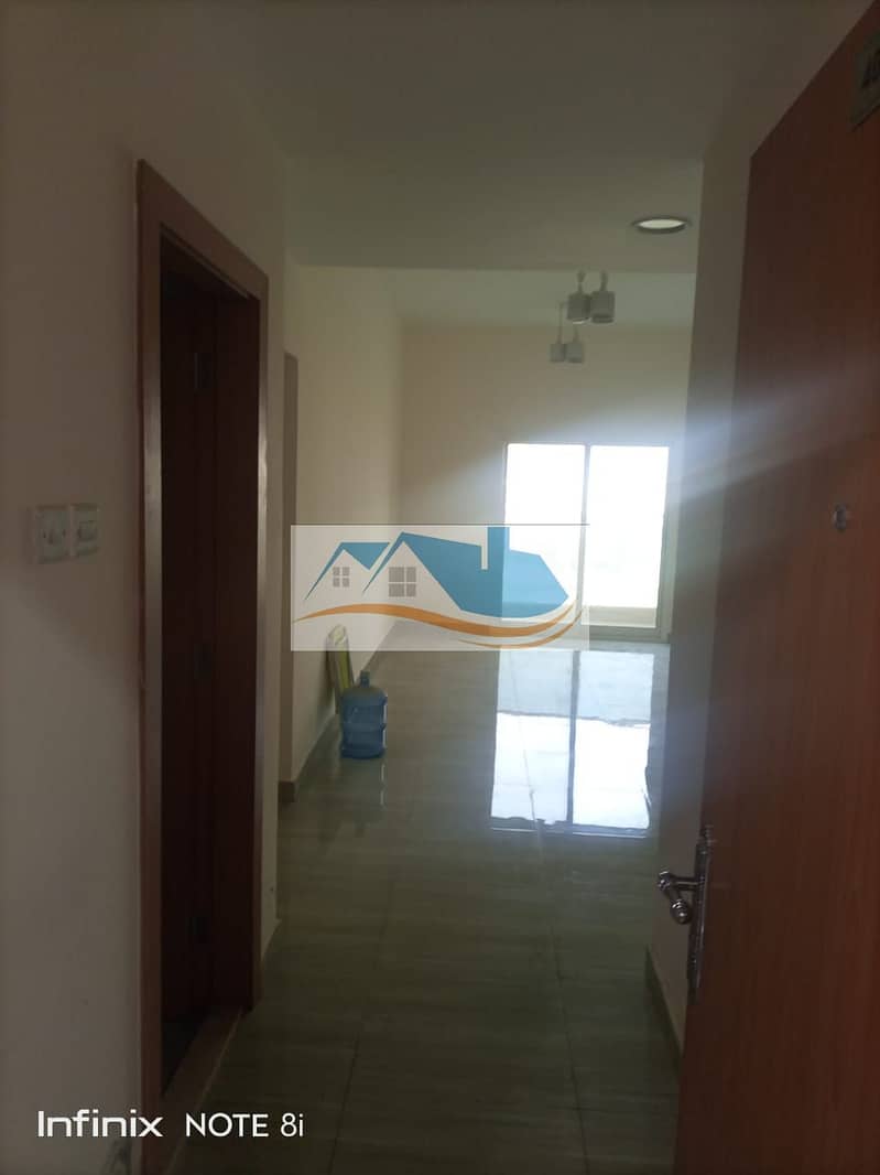 For annual rent in Ajman, a room and a hall in the Al-Jurf area 3, the first inhabitant building, and a free month, an excellent location