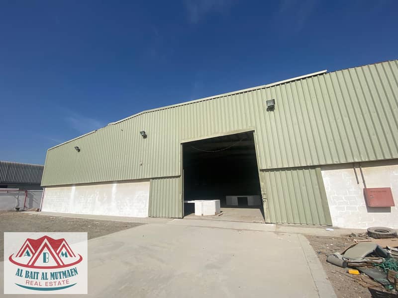 large warehouse and vacant land in the Emirates Industrial City Al Sajaa