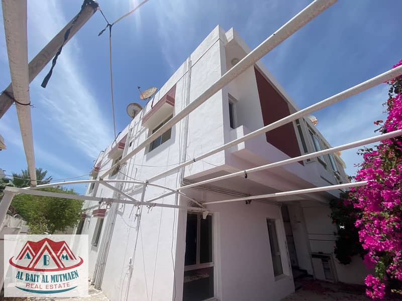 Two-storey villas next to beach other close to the sea in Al-Rifa'a