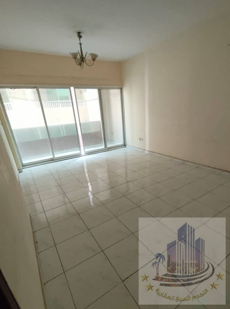 For rent in Ajman, two rooms and an annual hall, an apartment with 2 bathrooms, in Al Nuaimiya 1, Sheikh Khalifa Main Street