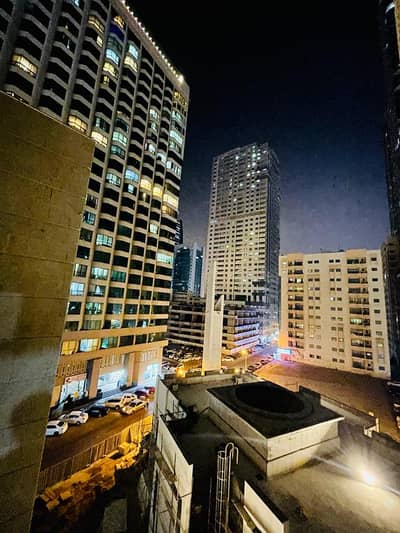 2 Bedroom Flat for Rent in Al Majaz, Sharjah - 2rooms, 2 hall, 3 bathrooms, a balcony, and a large parking space inside the building