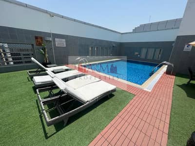 Studio for Rent in Al Nahyan, Abu Dhabi - Luxurious Fully Furnished Studio with Gym, Swimming Pool, & Basement Parking in Al Mamoura for AED 4,700 Monthly. !