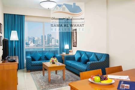 1 Bedroom Apartment for Rent in Al Qasba, Sharjah - Sharjah, Al Qasba, there is a room, a hall, 2 bathrooms, and a furnished kitchen, super lux.