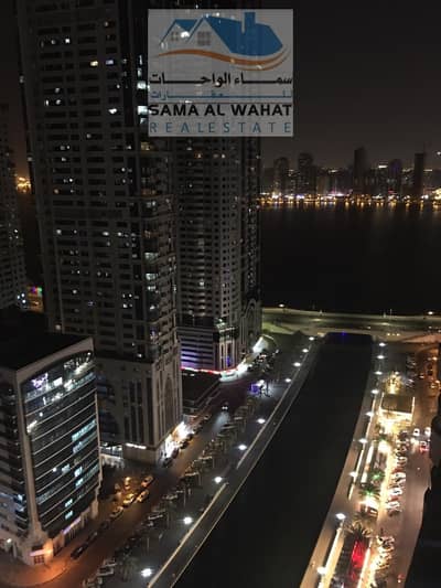2 Bedroom Flat for Rent in Al Qasba, Sharjah - Sharjah, Al Qasba, Palm Tower 3, sea view, two rooms, a hall, 2 bathrooms, and a kitchen.