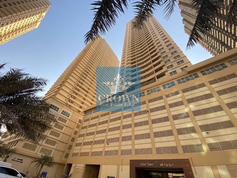 Best Offer! 1 Bedroom Hall w/upgraded kitchen and road /bldg. view in Lilies Tower Ajman