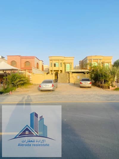 6 Bedroom Villa for Rent in Al Rawda, Ajman - Villa for rent in Ajman, Al Rawda area, the second piece of the street