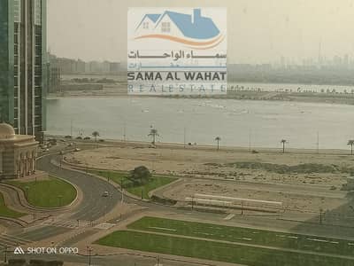 2 Bedroom Flat for Rent in Al Taawun, Sharjah - Al-Taawon apartment, two rooms, a large hall, lake views, a kitchen, and 3 bathrooms. The price is 40000,000 annually, including two months for free.