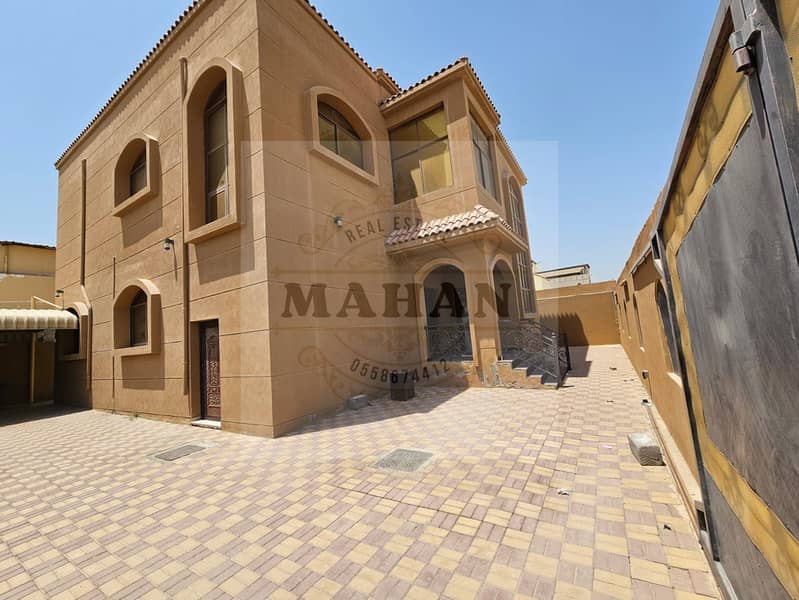 Spacious villa for sale without down payment 6 rooms, a hall, a majlis, a maid room with electricity and water, Al Rawda 1 area