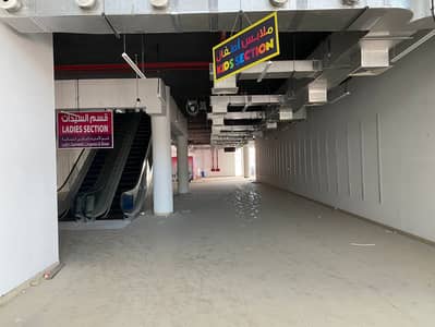 Showroom for Sale in Al Nuaimiya, Ajman - Mall for sale in Ajman, Al Ittihad Main Street, a very distinctive, lively location on three streets, central air conditioning, with a basement for pa