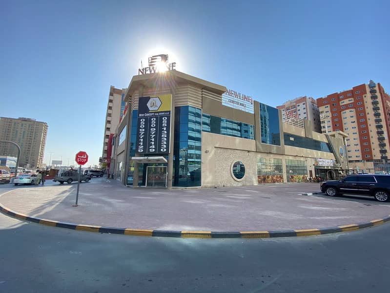 Mall for sale in Ajman, Al Ittihad Main Street, a very distinctive, lively location on three streets, central air conditioning, with a basement for pa Mall for sale in Ajman, Al Ittihad Main Street, a very distinctive, lively location on three streets, central air conditioning, with a basement for pa