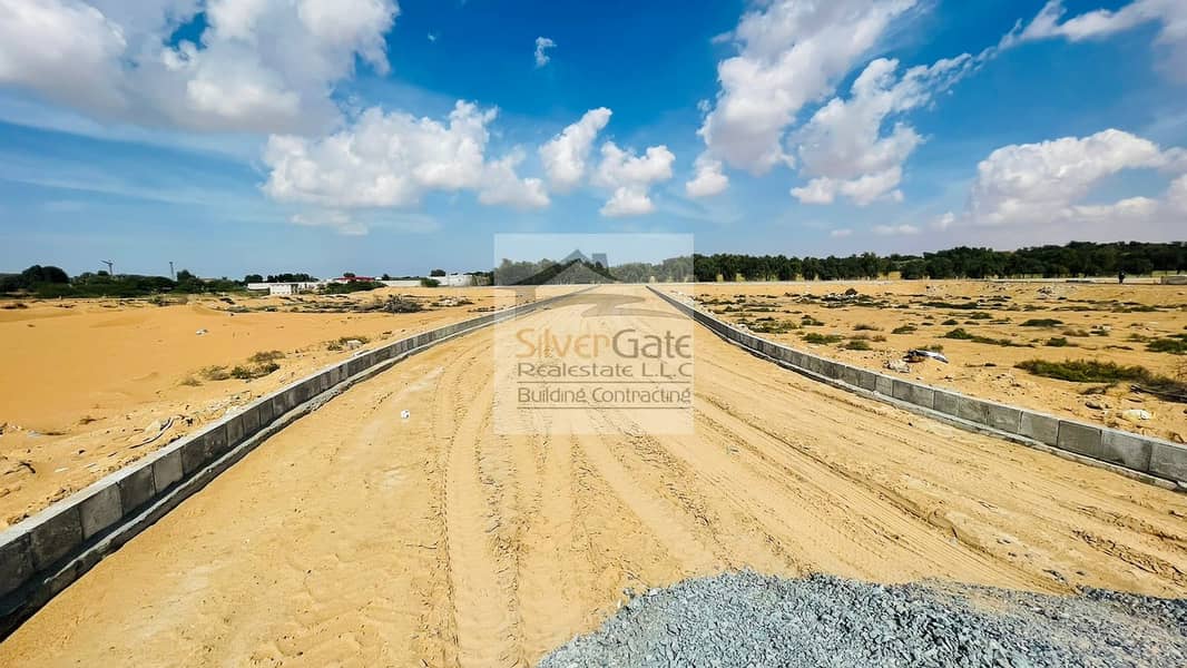 Residential Plots (lands) for sale on installments in ajman Main road Sheikh Muhammad Bin Zayed road Ajman