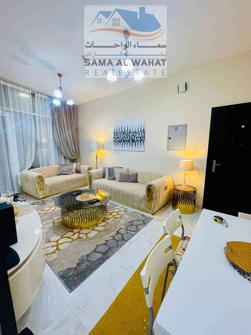 A room and a hall with 2 bathrooms and a balcony, Al Majaz 2, opposite Al Qasba, the Sultan Building, next to the Babel Towers,