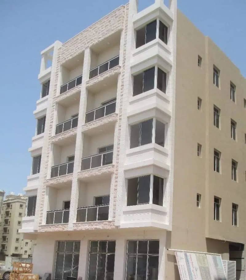 A new building with a corner and a path for sale in Al Hamidiyah, in an excellent location, behind the Ajman Court