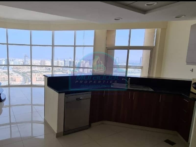 2 MAIN LIVING ROOM WITH A WINDOW WALL