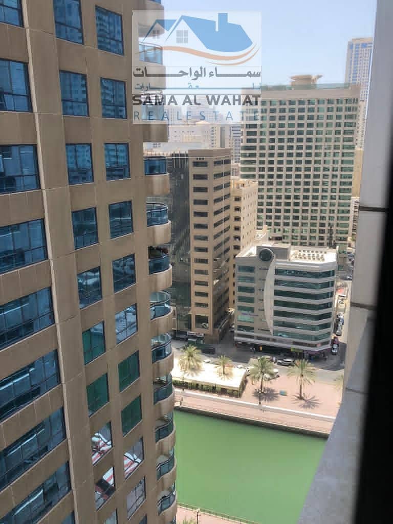 Sharjah, Al Qasba, Queen Tower, two rooms, a hall, and 2 bathrooms. The price is 5500, including