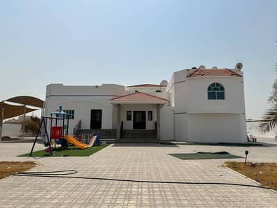 For sale a villa 4 BHK in the Tarfana area in Sharjah land area 32,000 square feet
