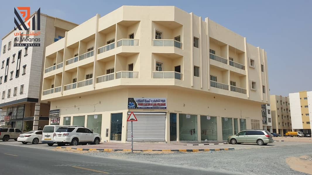 For sale a new building in Al Jurf - Ajman(9 shops - 12 bedrooms - 13 studios)