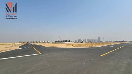 Plot for Sale in Al Helio, Ajman - In installments, residential investment lands, Al Helio , a distinguished location near Al Watan University, freehold, including fees
