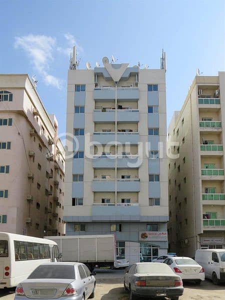 For rent, a large studio with a balcony, central air conditioning, Ajman Al Nuaimiya, behind Nesito