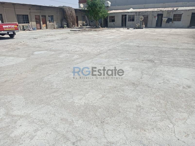 Versatile Commercial Property: 43,000 Sqft Land with Office Shed for Rent in Umm Ramool