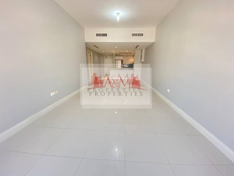 HOT DEAL . : One Bedroom Apartment  with  Gym & Parking for AED 50,000 Only. . !!