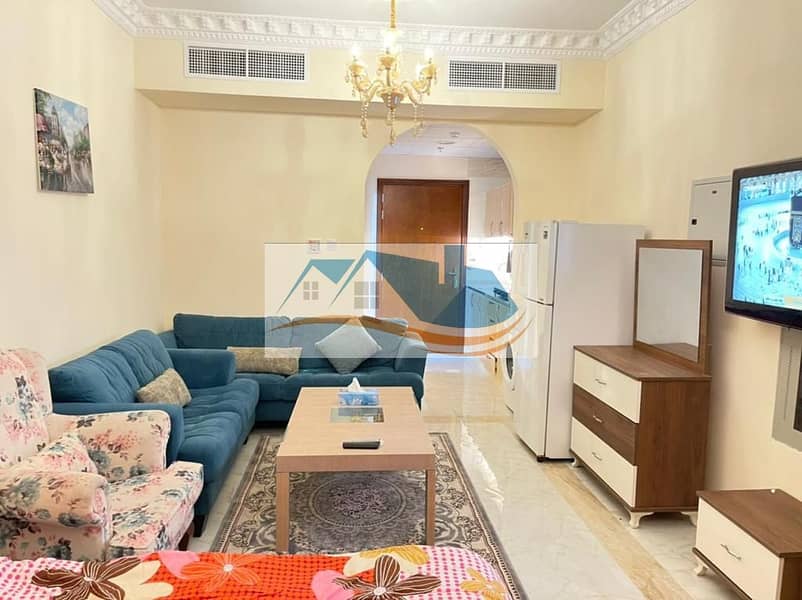 Furnished studio, Super Dulux, in Al Jarf area, including electricity, water, sewage, and internet, the first inhabitant building, close to services,