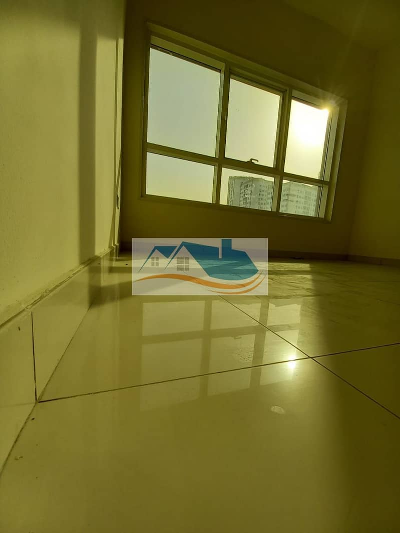 For rent in Ajman, a three-bedroom apartment and a hall in the Mushairif area behind the telecom company, free air conditioning on the owner, with a g