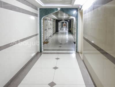 2 Bedroom Apartment for Rent in Bu Daniq, Sharjah - 2 B/R HALL FLAT WITH SPLIT DUCTED A/C AND BALCONY AVAILABLE IN BU DANIQ AREA NEAR AL RAYAN HOTEL