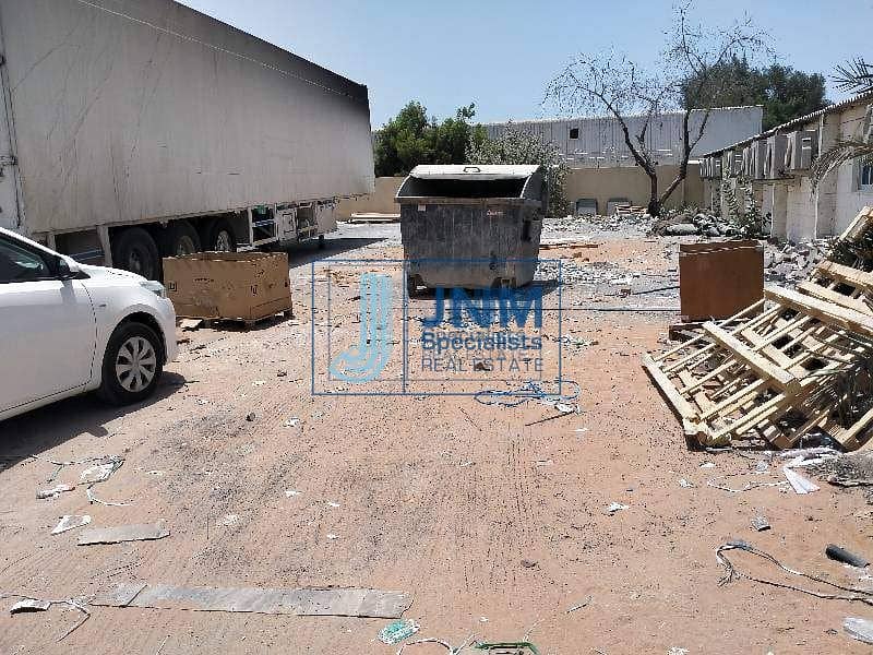 Commercial land with warehouse for rent in al quoz