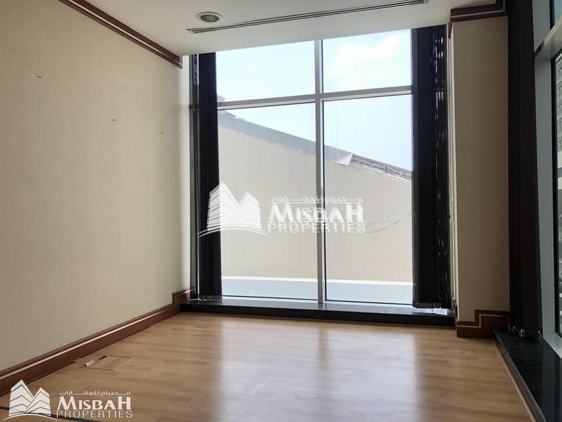 9 Fully Customized Fitted Office with partitions in a Chiller Free Building | Al Garhoud