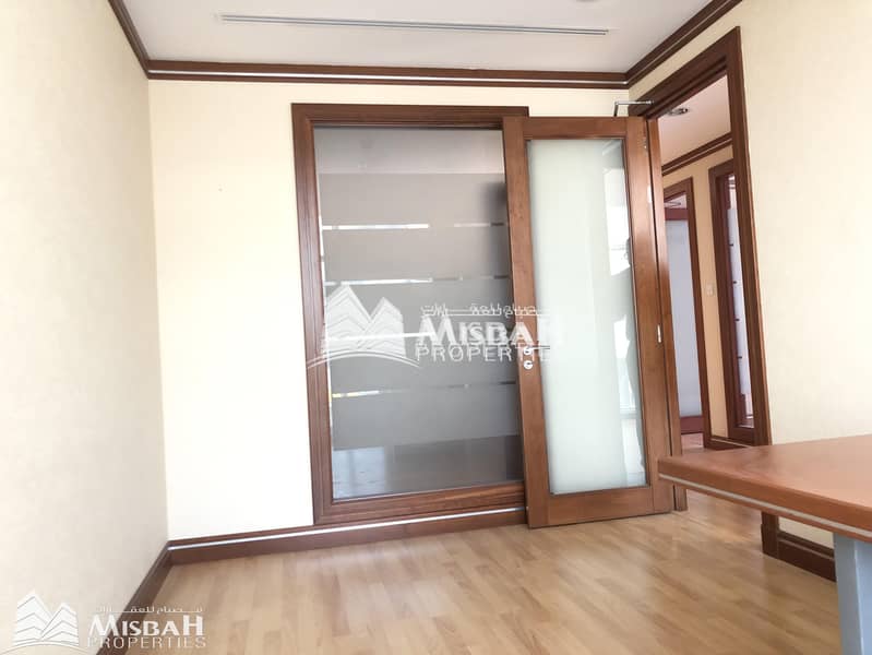 10 Fully Customized Fitted Office with partitions in a Chiller Free Building | Al Garhoud