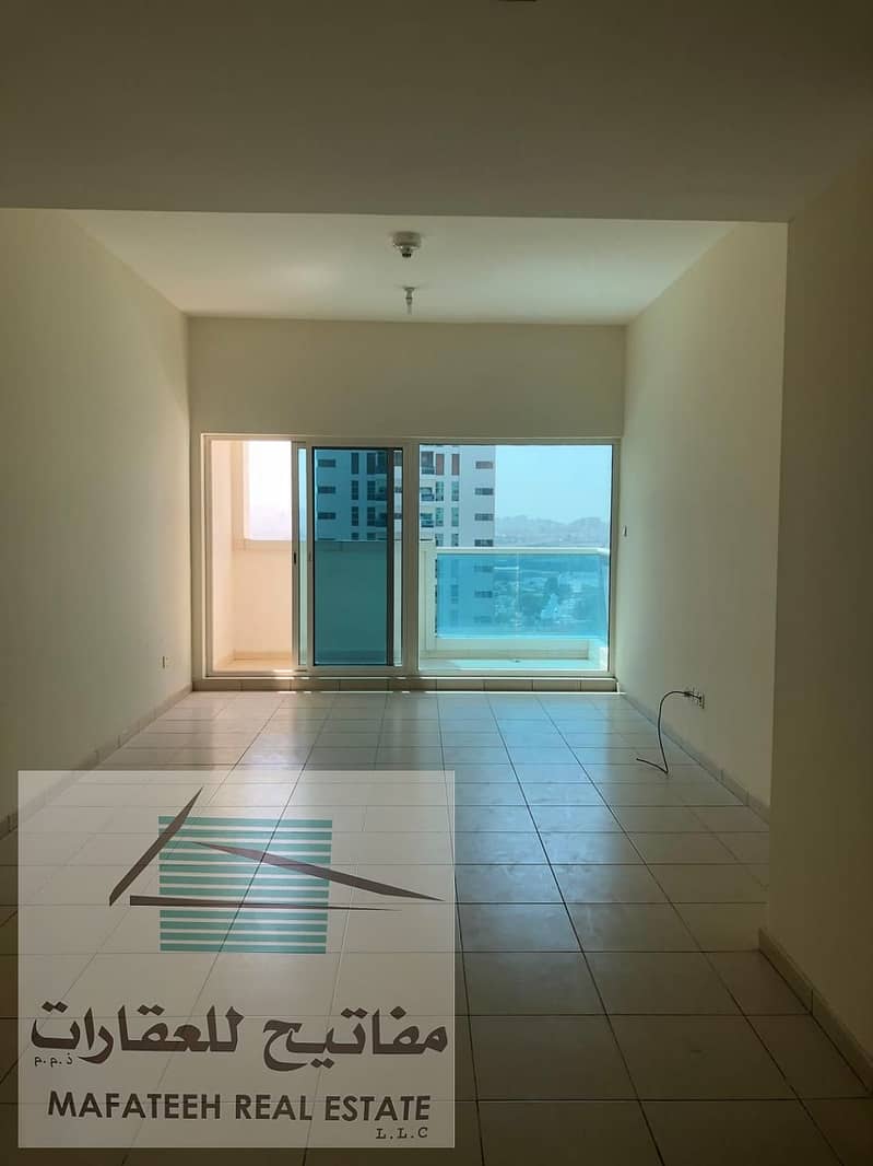 AJMAN ONE TOWERS  2 bedroom hall big size apartment for rent 33,000AED only