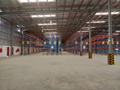 Warehouse for Sale in Jebel Ali, Dubai - 74,000 sqft Warehouse with office and loading bay Fully Rent out, 2025