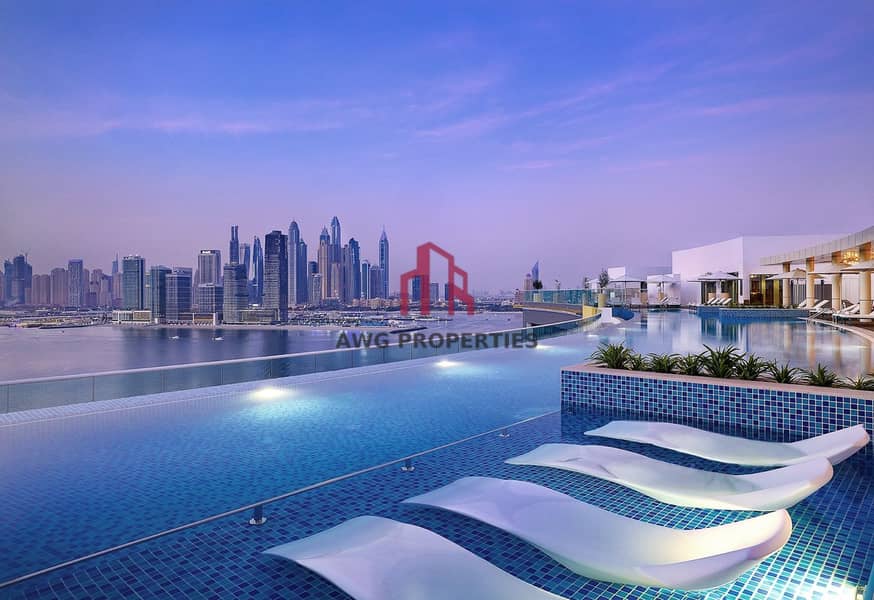 2 NH_Collection_Dubai_The_Palm_Pool View_Evening (1)-min. jpg