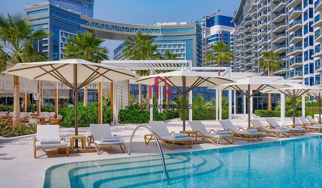 5 NH_Collection_Dubai_The_Palm_Dining_12_Beach_Pool_2. jpg
