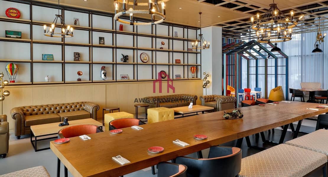 10 NH_Collection_Dubai_The_Palm_Dining_16_Revo_Cafe. jpg